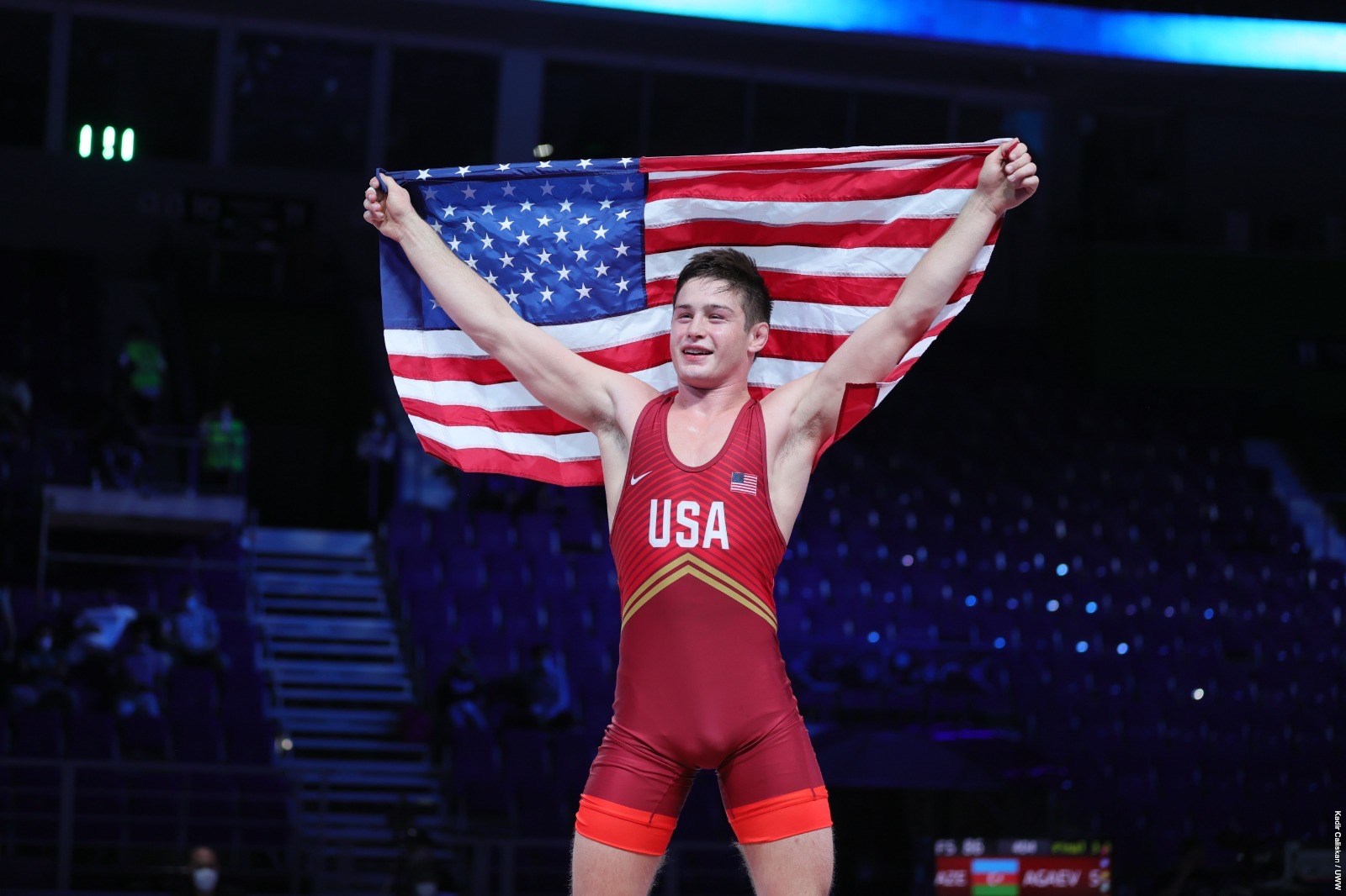 Keegan O'Toole holds the American flag up after winning the Junior World Championship