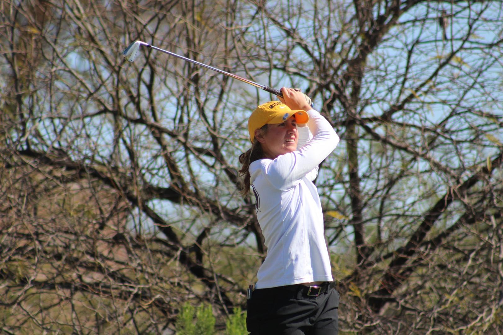 Melanie Walker holds her pose after a tee shot.