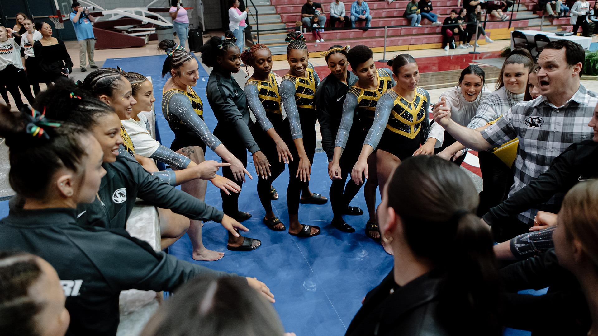 Missouri gymnastics breaks a huddle at Texas Woman's